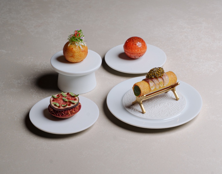 Gourmet dishes served on elegant plates.